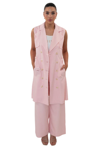 Long line pink vest styled with its matching pants.