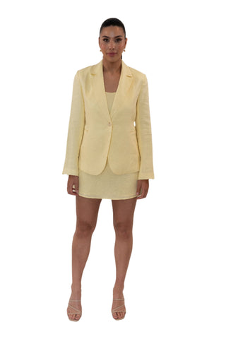 Yellow linen single breasted blazer with split sleeves styled with its matching dress.