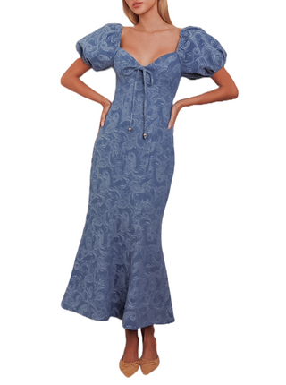 Puff sleeve denim maxi dress with sweetheart neckline, tie front and mermaide design.